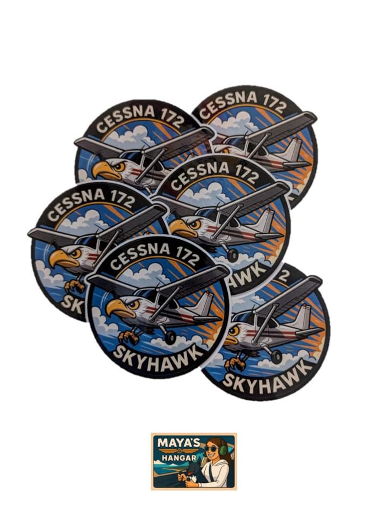 May include: A collection of circular stickers featuring a Cessna 172 Skyhawk airplane design. The stickers have a blue and white background with an eagle graphic. The text "Cessna 172" and "Skyhawk" are also included. A smaller sticker with the text "Maya's Hangar" is also present.
