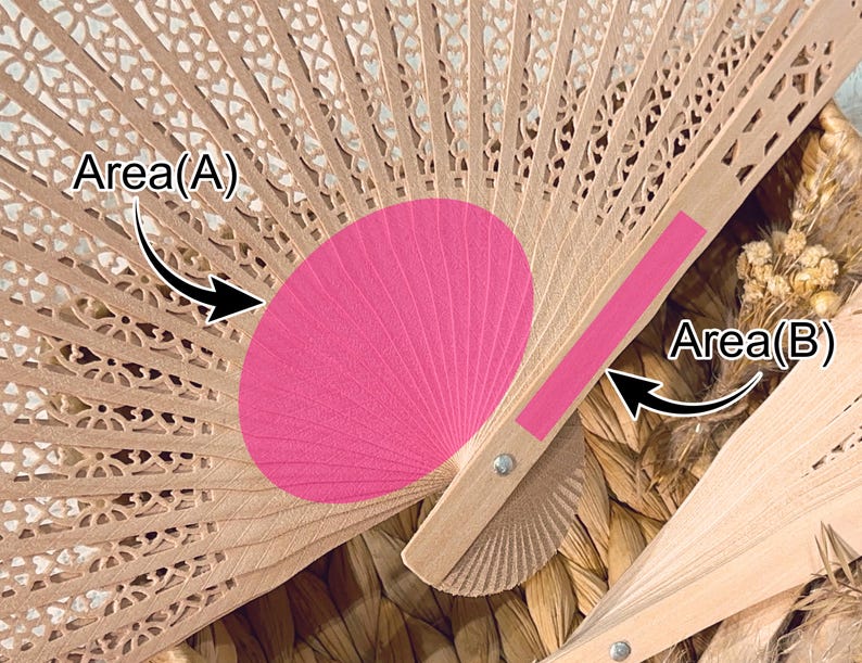 May include: A close-up of a partially open wooden hand fan with a pink center. The fan has a delicate, openwork design with floral patterns. The pink section is a solid color, contrasting with the natural wood tone.