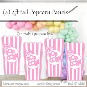 May include: Four pink and white striped popcorn panels, each 4ft tall, with "fresh POPCORN" text. The panels are made of 4mm corrugated plastic and can make one popcorn box. A balloon arch is in the background.
