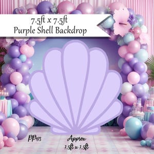 May include: A light purple shell-shaped backdrop, approximately 7.5ft x 7.5ft, with the text "Purple Shell Backdrop." The backdrop is surrounded by a balloon arch in shades of purple, pink, and blue, creating a festive atmosphere.