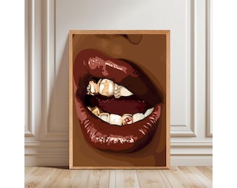 May include: A framed art print featuring a close-up of a mouth with glossy, dark red lips. The teeth are adorned with gold grills, some with diamond accents. The artwork is set against a brown skin tone background.