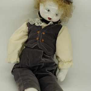 Vintage Porcelain Clown Doll: Hand-Painted Face, Velvet Overalls