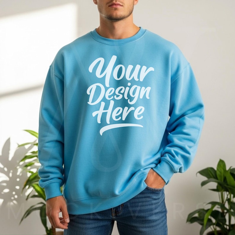 Light blue crewneck sweatshirt with long sleeves and relaxed fit, styled with blue jeans in natural sunlight—crafted for mockup designers on Etsy and Printify.