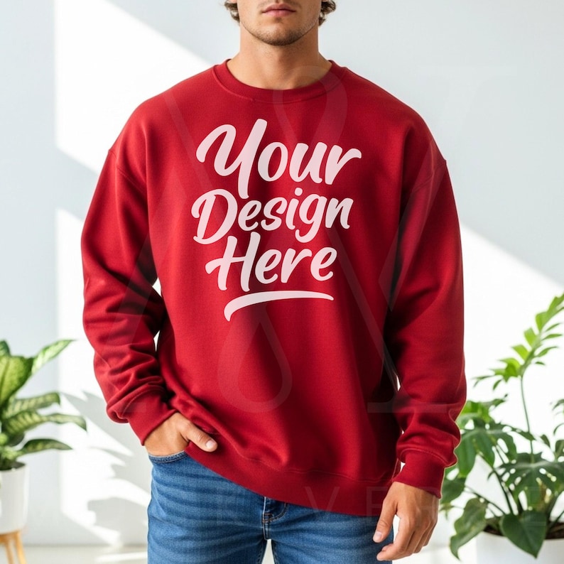 Red crewneck sweatshirt with long sleeves and relaxed fit, paired with blue jeans in bright natural light—ideal for Etsy shop owners and Printify designers.