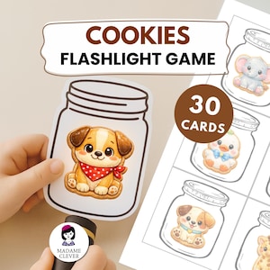 May include: A children's game with the text "COOKIES FLASHLIGHT GAME" on the top. The game includes 30 cards with illustrations of cookies in jars. One card is held by a hand, and a flashlight is held below the card.