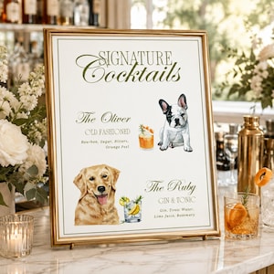 May include: A rectangular gold-framed sign titled Signature Cocktails featuring a watercolor illustration of a French Bulldog next to The Oliver Old Fashioned and a Golden Retriever next to The Ruby Gin & Tonic with ingredient lists for each.