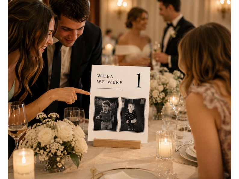 Wedding guests enjoying a When We Were childhood photo table number at a reception. Editable Canva wedding photo sign, sentimental wedding table decor, old money centerpiece template and printable reception table number.