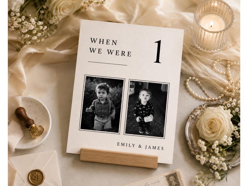 Flat lay of a When We Were wedding photo table number template with luxury wedding stationery styling. Editable Canva childhood photo table sign, minimalist old money wedding decor and printable reception centerpiece.