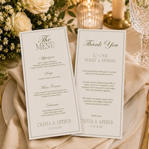 May include: Two rectangular off-white paper cards featuring dark green text. One card is titled The Menu with sections for appetizers, soup, main course, and desserts. The other is a Thank You note to family and friends, signed Olivia & Arthur 12.11.2028.