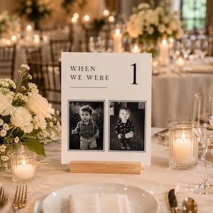 When We Were age photo table number template displayed at a luxury wedding reception. Editable Canva wedding photo table sign featuring childhood photos, elegant old money design, minimalist wedding centerpiece and printable table number.