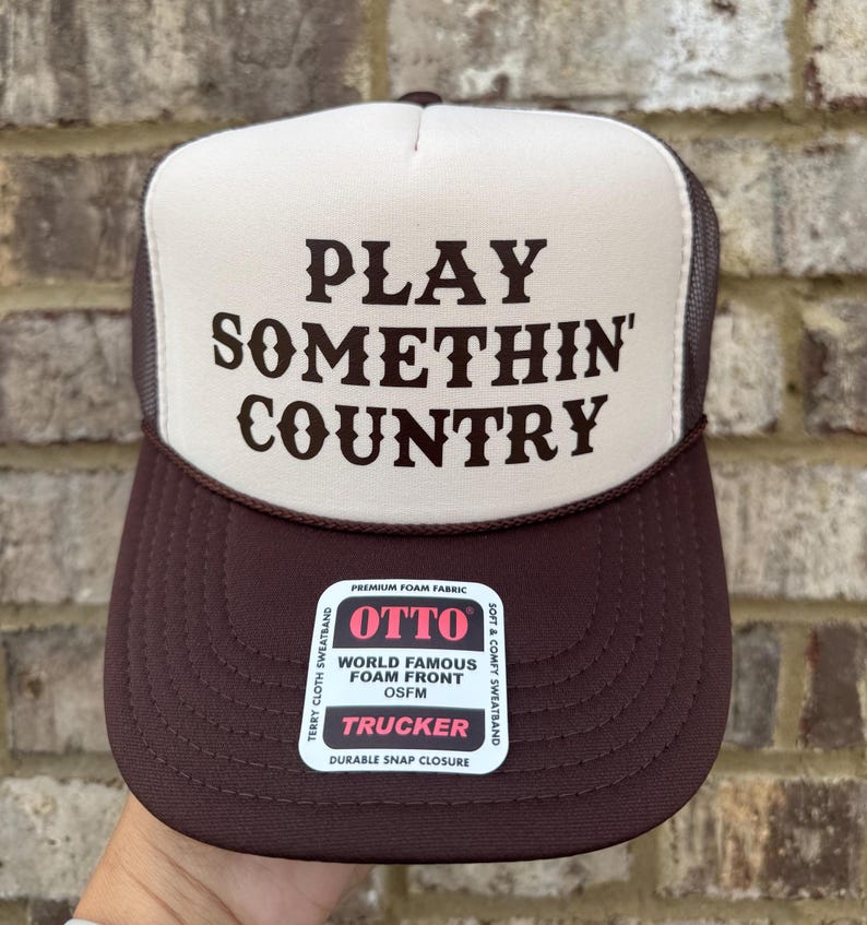 brown/tan hat with Brown text