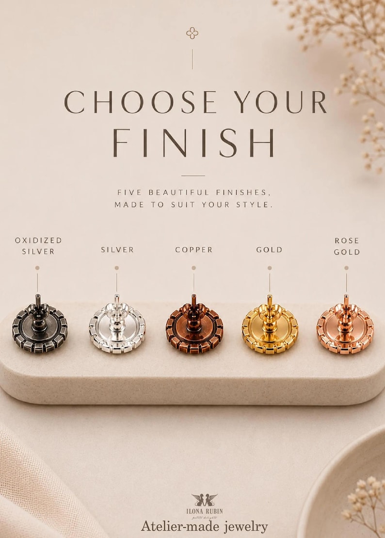 May include: Five circular earring backs with notched edges, displayed in oxidized silver, silver, copper, gold, and rose gold finishes. Text reads: CHOOSE YOUR FINISH, FIVE BEAUTIFUL FINISHES, MADE TO SUIT YOUR STYLE, ILONA RUBIN Atelier-made jewelry.