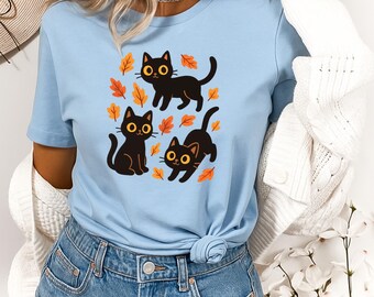 Niedliches und gemütliches schwarze Katzen, die Herbstblätter süßes Herbst-T-Shirt, gemütliches Katzenliebhabergeschenk, Herbstästhetische schwarze Katze.