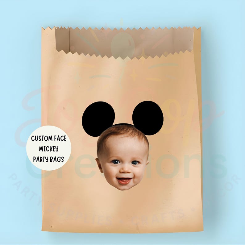May include: A brown paper party bag featuring a Mickey Mouse face design. The design incorporates two black circles as ears and a baby's face. The bag has the text "CUSTOM FACE MICKEY PARTY BAGS" on a white circle.