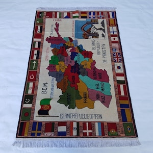 May include: A rectangular rug with a map design, featuring various regions and flags. The rug has a cream-coloured background with a colourful map of a region, surrounded by flags and text. The rug has a fringe on the short ends.