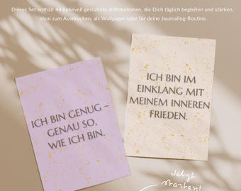 May include: Two affirmation cards with text in German. One card is lavender with the text "ICH BIN GENUG - GENAU SO, WIE ICH BIN." The other is cream-colored with the text "ICH BIN IM EINKLANG MIT MEINEM INNEREN FRIEDEN."