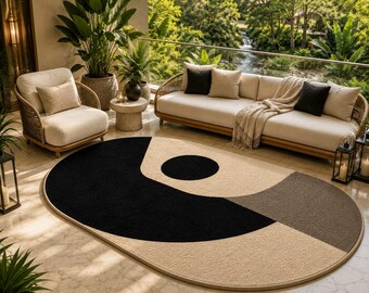 Modern ovaal abstract vloerkleed, geometrisch tapijt in zwart-crème, minimalistisch Scandinavisch vloerkleed