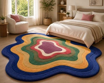Kleurrijk abstract golvend vloerkleed, modern tapijt met onregelmatige vorm, getuft statementkleed, speelkamerdecoratie