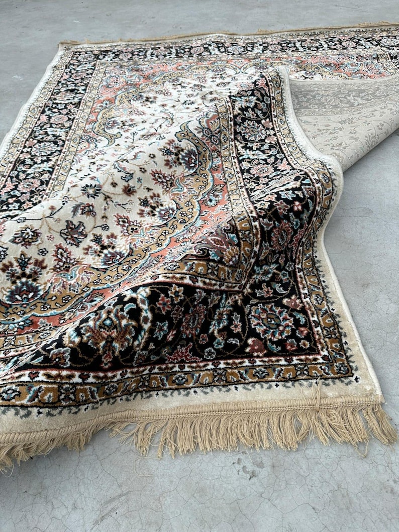 Close-up of silk wool rug fibers highlighting premium craftsmanship, intricate pattern, and soft texture
