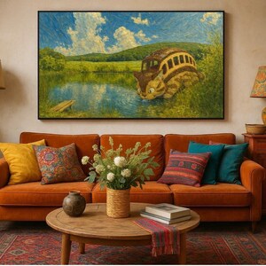 May include: A living room scene featuring an orange sofa with decorative pillows, a round wooden coffee table, and a large framed painting depicting a whimsical bus-like creature by a lake. A floor lamp and a side table with a lamp complete the cozy setting.