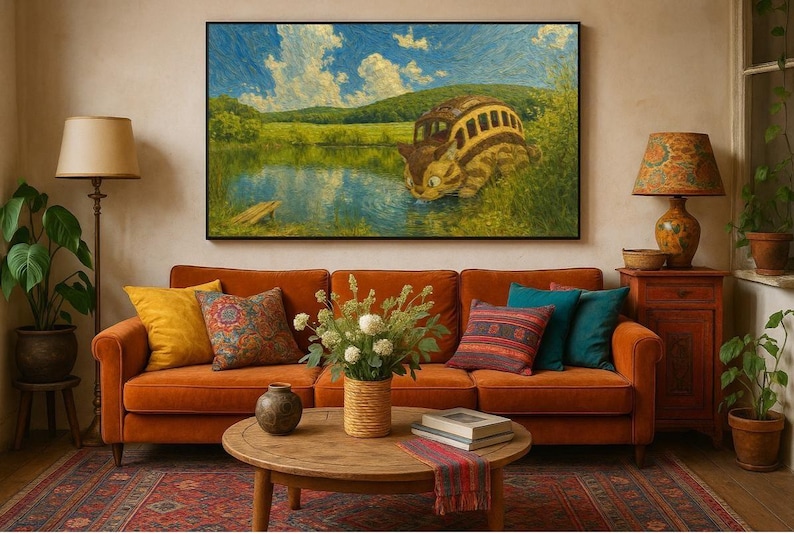 May include: A living room scene featuring an orange sofa with decorative pillows, a round wooden coffee table, and a large framed painting depicting a whimsical bus-like creature by a lake. A floor lamp and a side table with a lamp complete the cozy setting.
