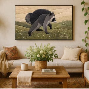 May include: A rectangular wall art piece featuring a stylised raccoon walking through a green, hilly landscape with white flowers. The background consists of layered beige hills under a soft sky. The name Timothy is written in cursive in the corner.