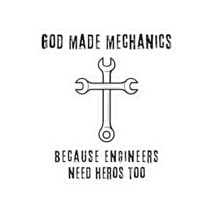 May include: A white sticker with black text and a wrench design. The text reads "GOD MADE MECHANICS" above a wrench cross, and "BECAUSE ENGINEERS NEED HEROES TOO" below. The design is suitable for mechanics and engineers.