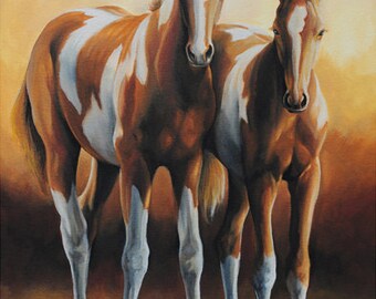 May include: Two brown and white paint horses with white legs and manes stand side by side against a warm, golden background.
