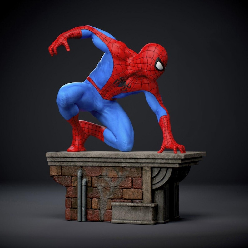 May include: A figurine of Spider-Man in a crouching pose, wearing a red and blue suit. The figure is atop a brick and stone structure, with a dark background. The figure's pose suggests readiness for action.
