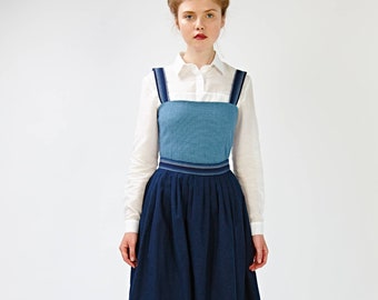 blue dress and white apron PINAFORE APRON IN INDIGO CHAMBRAY AND NAVY GINGHAM – LIBBIE SUMMERS main image 1