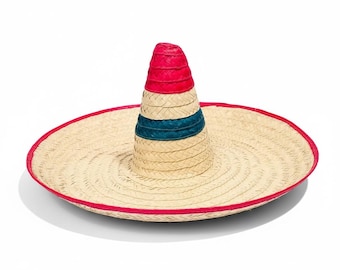 May include: A woven straw sombrero with a wide brim and a tall, conical crown. The brim is trimmed with red, and the crown features red and teal bands. The hat is set against a white background.