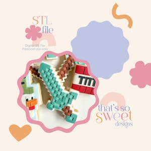 May include: Cookies decorated with pixelated designs, including a sword, TNT, and a chicken. The cookies are in a pink, scalloped frame, with the text "that's so sweet designs" and "STL file" in the background. The background is a light beige colour.