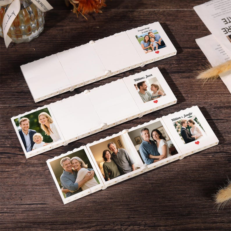 May include: Three white, interlocking, brick-style photo display frames. Each frame features a square photo insert, some with printed text like 'Love you always no matter what', 'William & Jason', or 'William & Jennifer' and small red heart icons.