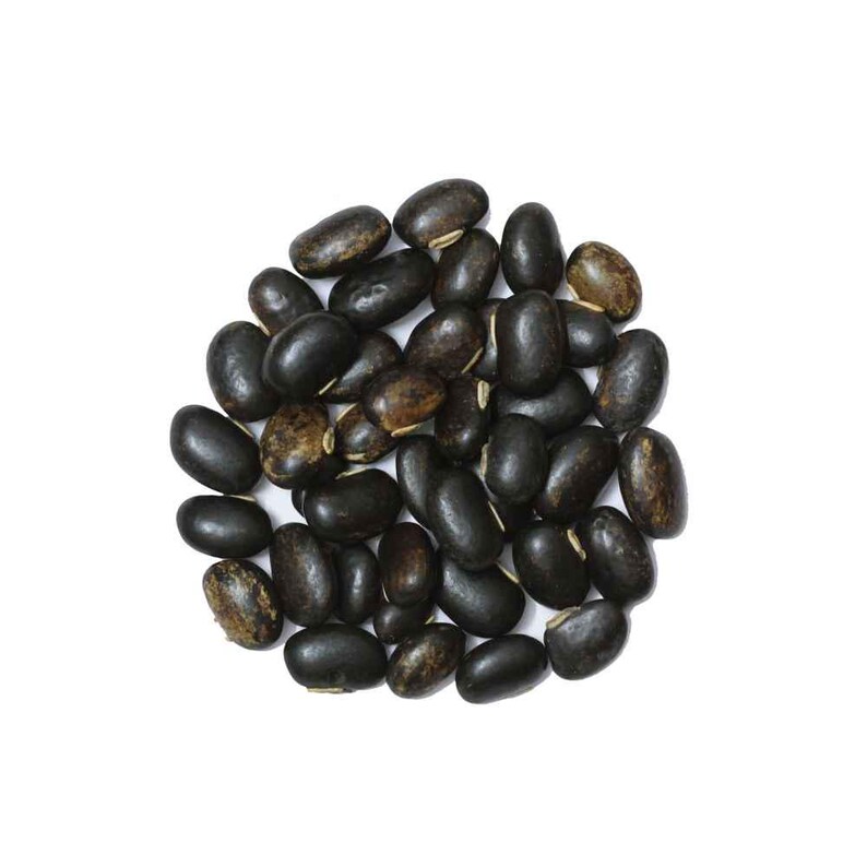 May include: A pile of black beans, oval-shaped with a smooth texture, against a white background. Some beans have a mottled, brown appearance. The beans are evenly distributed, filling the frame.