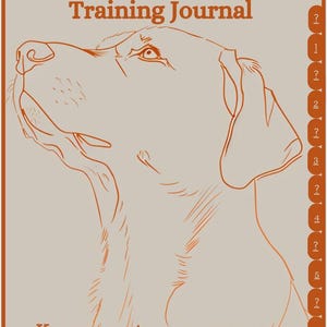May include: A training journal with the text "BUDDY x BONES K9 Training Journal" and "Keep a scent on your progress." The cover features an orange line drawing of a dog's head on a beige background.