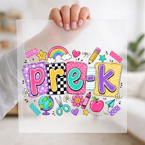 May include: A square, semi-transparent sheet featuring the colorful text 'pre-k' in playful, patterned bubble letters. The design is surrounded by school-themed illustrations including a globe, scissors, a pencil, a crayon, an apple, and a rainbow.