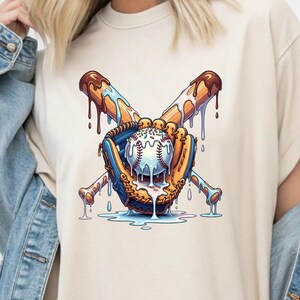 May include: Cream-colored t-shirt featuring a baseball-themed graphic. The design includes a baseball, a glove, and crossed bats, all with a melting ice cream effect. The baseball is white with red stitching, and the bats are brown with dripping chocolate.