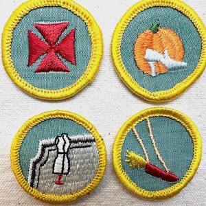 May include: Four embroidered patches with teal backgrounds and yellow borders. Designs include a red cross, an orange pumpkin with a white shoe, a sewing machine with a dress form, and a red swing with a yellow tassel.