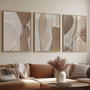 ニュートラルベージュの抽象アートプリント3枚セット。モダンな抽象ラインとオーガニックシェイプのプリント。ミニマリストなギャラリーウォールアート。モダンな寝室の装飾。