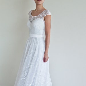 Lace wedding skirt in A-line silhouette made in delicate Chantilly lace over tulle and satin under layers.