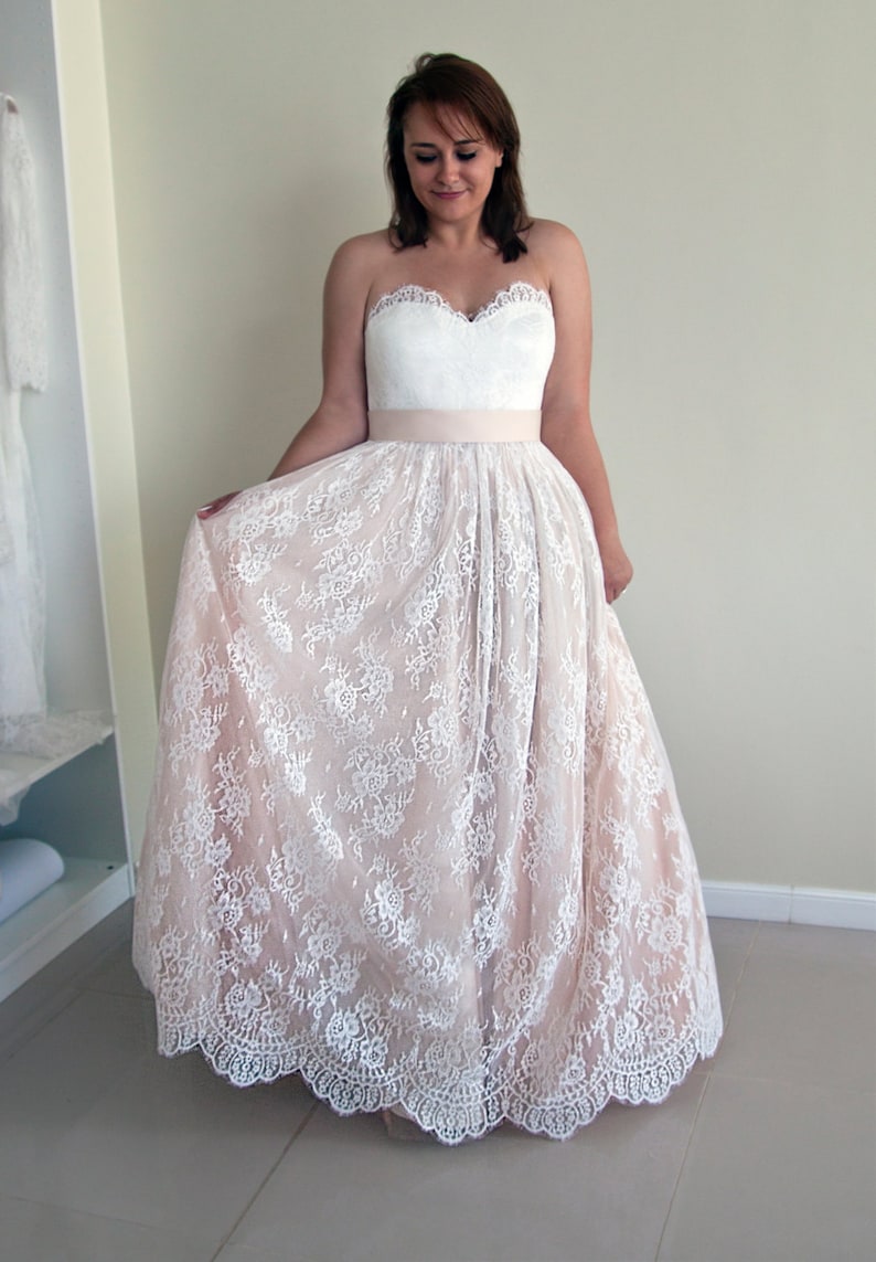Lace wedding skirt in A-line silhouette made in delicate Chantilly lace over tulle and satin under layers.