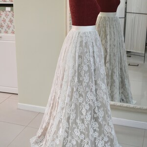 Lace wedding skirt in A-line silhouette made in delicate Chantilly lace over tulle and satin under layers.