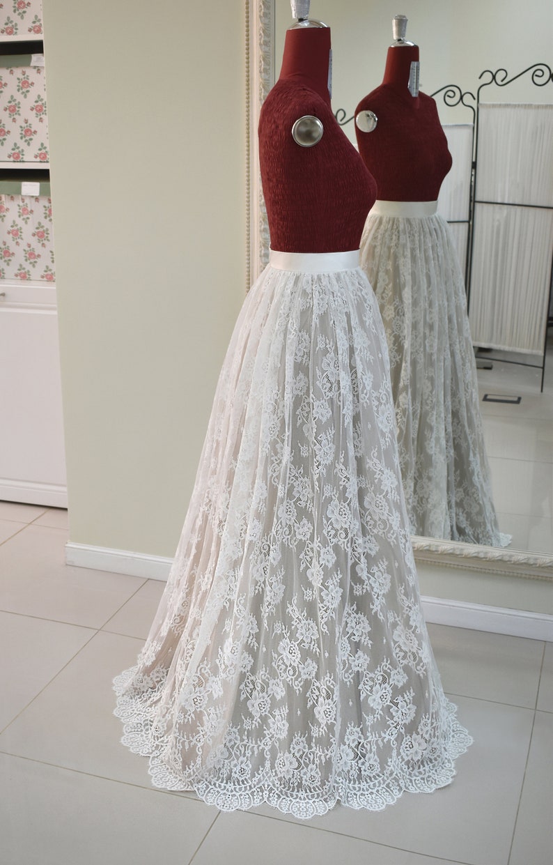 Lace wedding skirt in A-line silhouette made in delicate Chantilly lace over tulle and satin under layers.