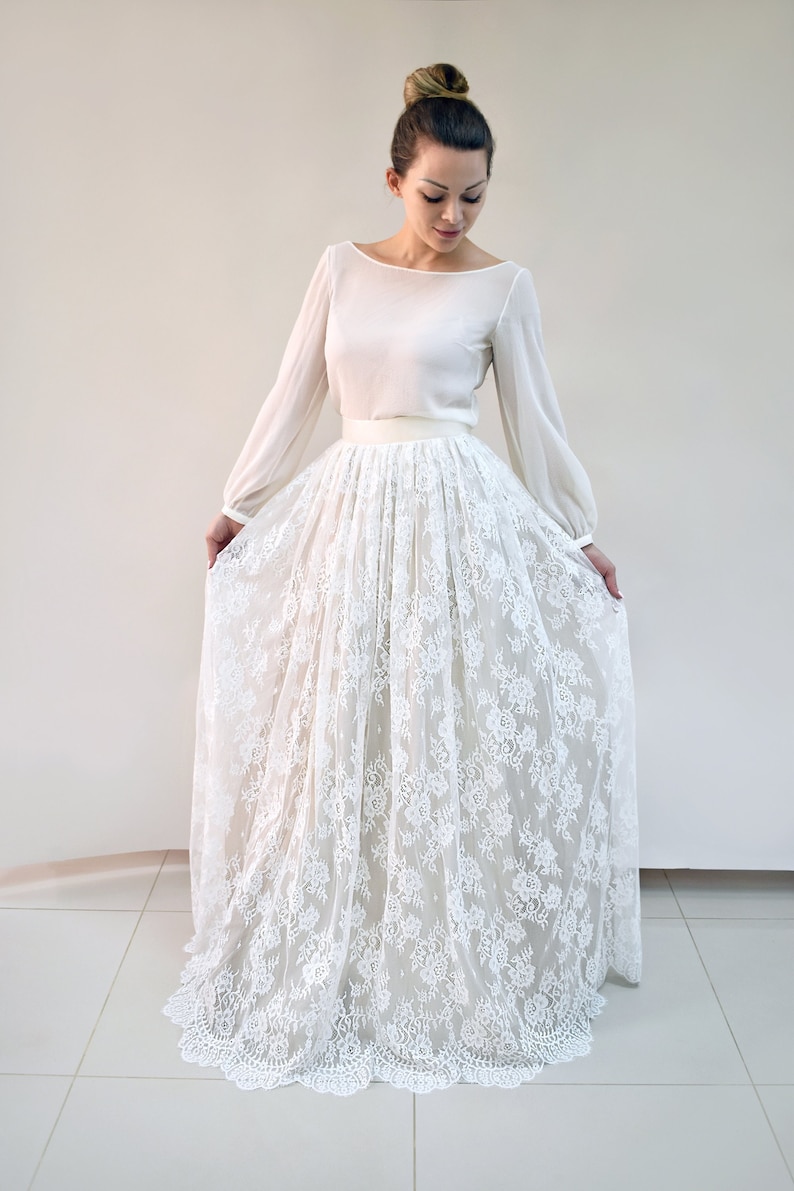Lace wedding skirt in A-line silhouette made in delicate Chantilly lace over tulle and satin under layers.