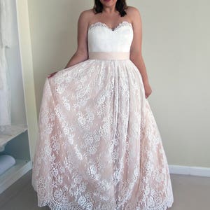 Wedding lace skirt in A-line silhouette made in delicate Chantilly lace over tulle and satin under layers.