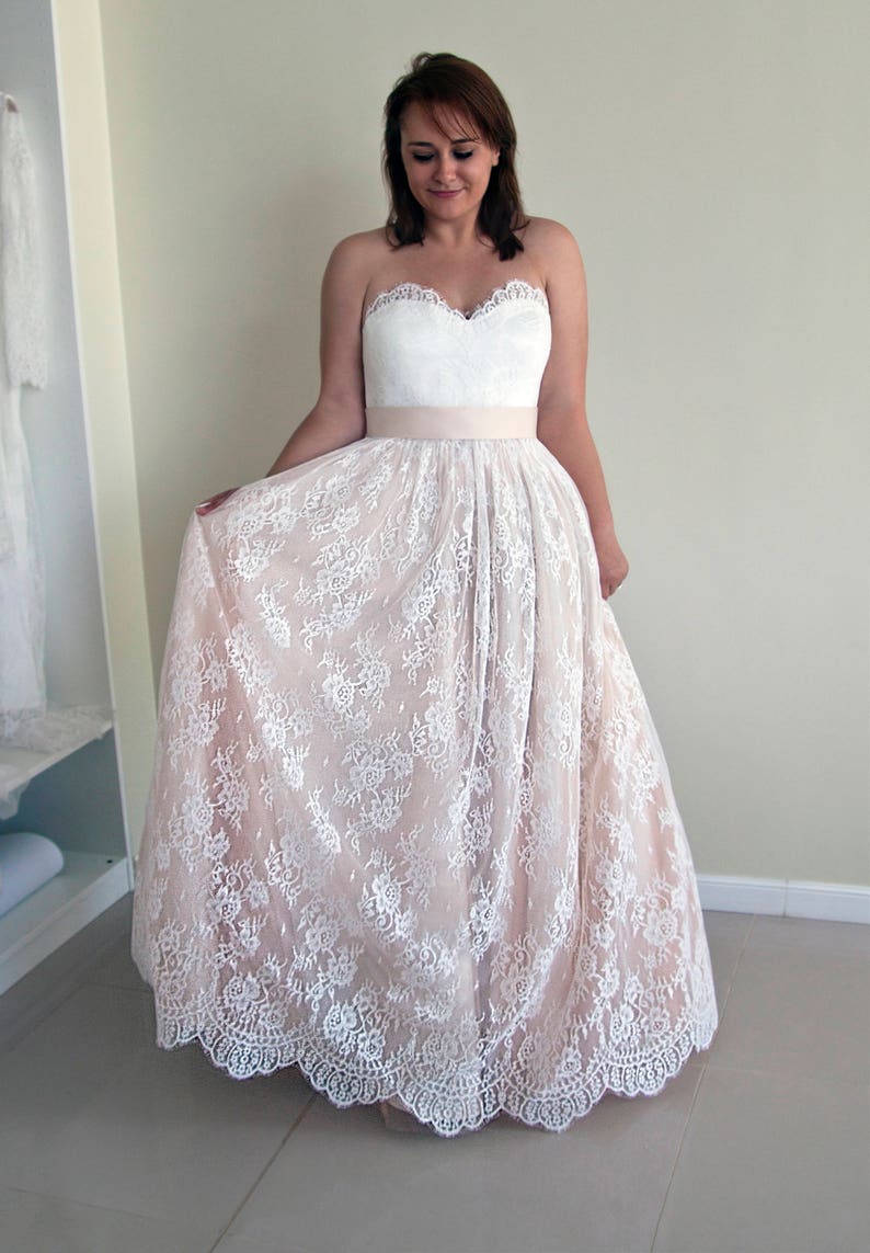 Wedding lace skirt in A-line silhouette made in delicate Chantilly lace over tulle and satin under layers.