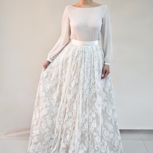 Lace wedding skirt in A-line silhouette made in delicate Chantilly lace over tulle and satin under layers.