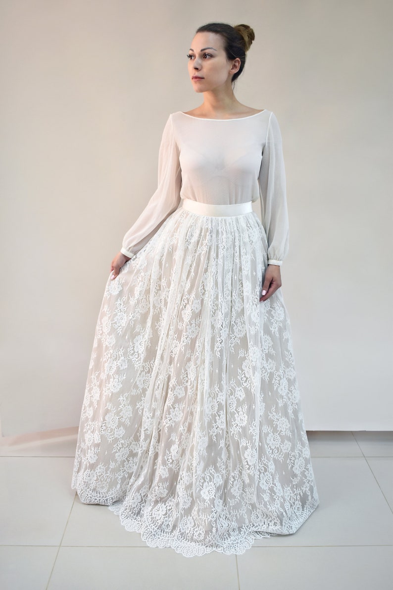 Lace wedding skirt in A-line silhouette made in delicate Chantilly lace over tulle and satin under layers.