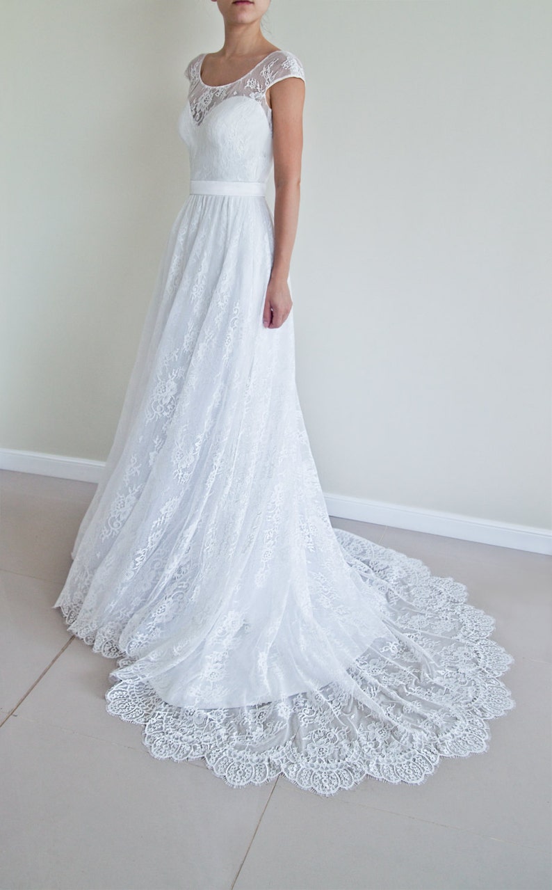 Lace wedding skirt in A-line silhouette made in delicate Chantilly lace over tulle and satin under layers.