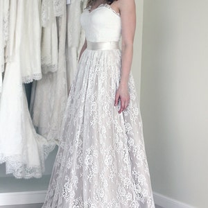 Wedding lace skirt in A-line silhouette made in delicate Chantilly lace over tulle and satin under layers.